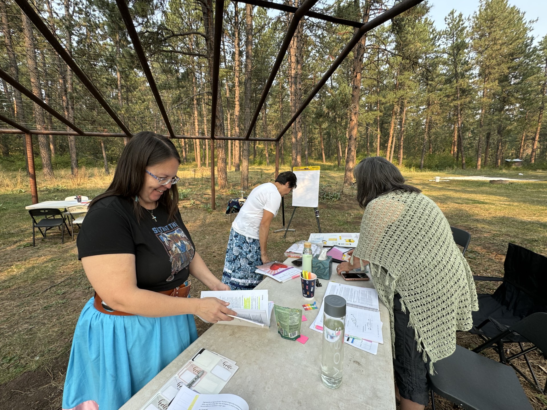 Women preparing for a healing group event in the forest